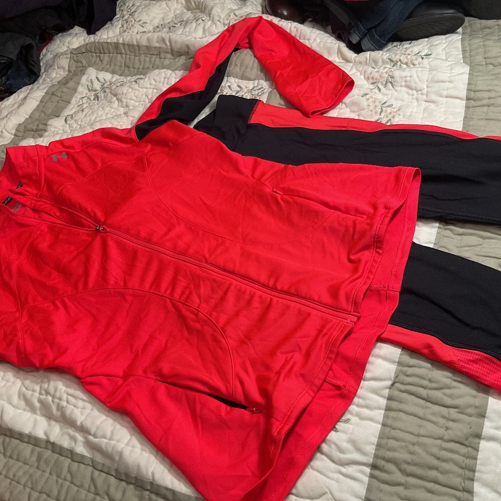 Coral and black colored under armor workout outfit top is size large.